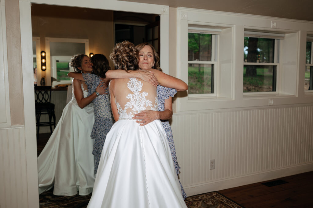 bride and mother-in-law hugging